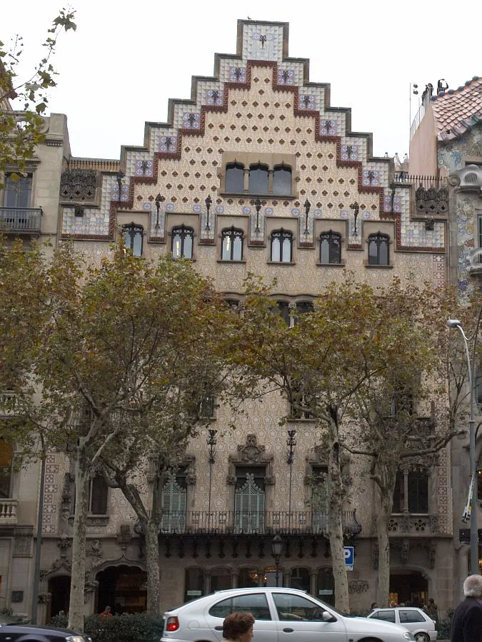 The stepped, tiled gable of Casa Amatller on Passeig de Gràcia, with the edge of Casa Batlló on the right