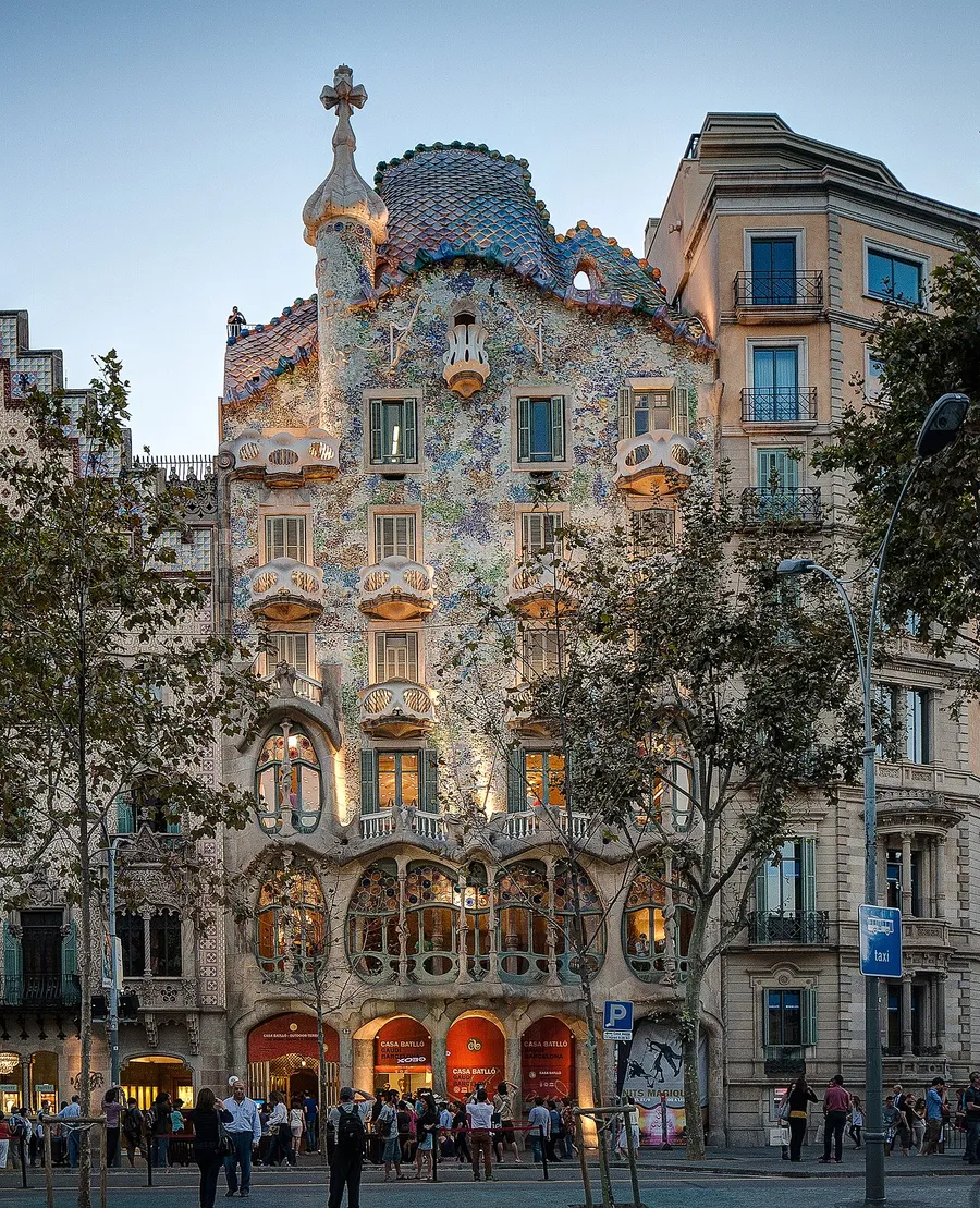 The façade of Casa Batlló on Passeig de Gràcia, with bone-shaped columns, coloured glass and a curved roof
