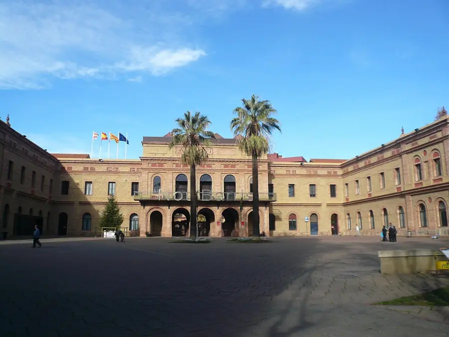 The long brick facade of the former Institut Mental de la Santa Creu, now the Nou Barris district hall