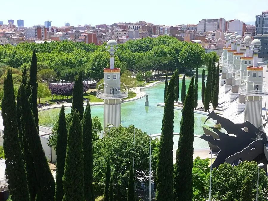 The lake, stepped terraces and lighthouse towers of the Parc de l'Espanya Industrial